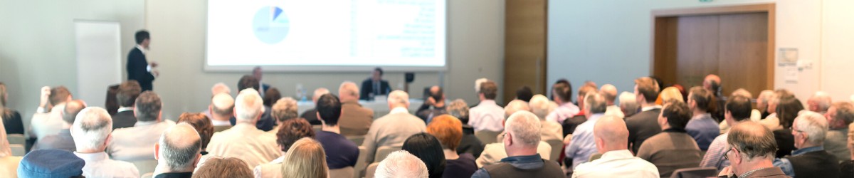 Speakers and audience in the conference room